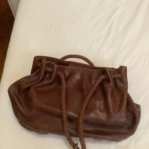 Eileen Fisher hobo bag woven handle.  Embossed floral.  Lightly loved.